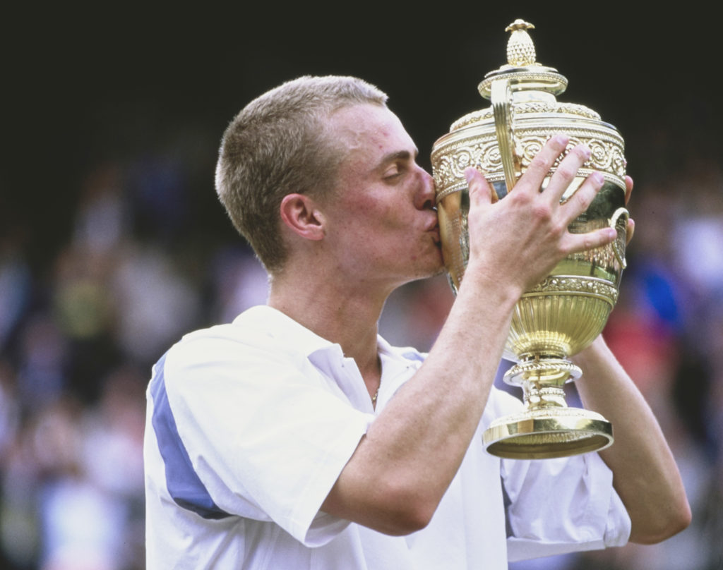 Lleyton Hewitt kisses the Wimbledon trophy after winning the title in 2002