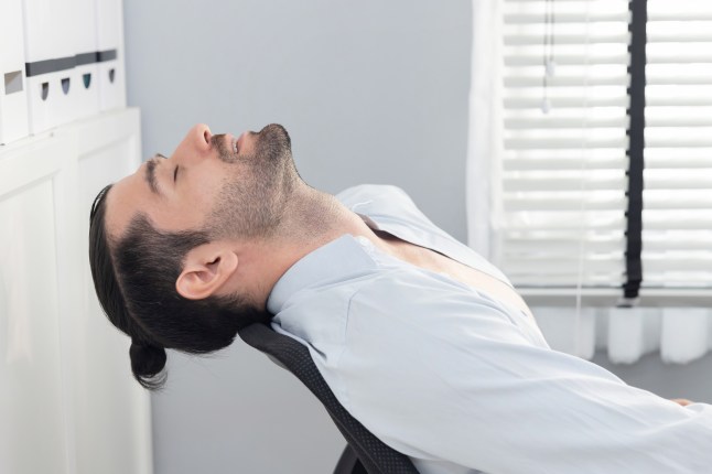 Caucasian Businesman Leaning Back in Chair