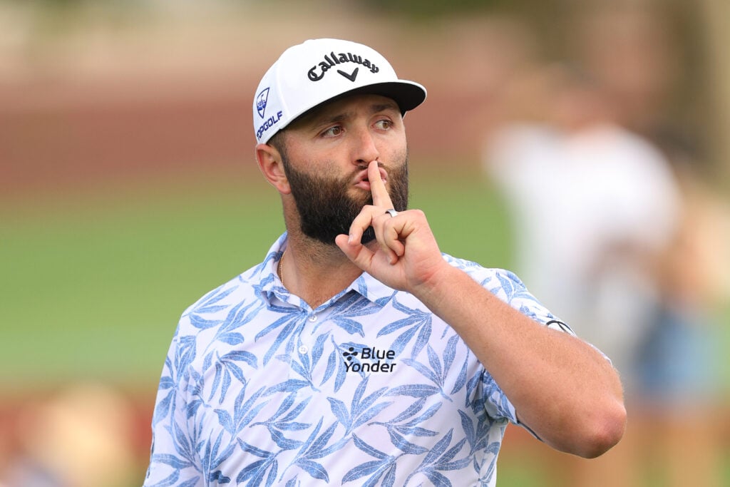Jon Rahm of Spain gestures with his hand to his mouth on course during Day Three of the DP World Tour Championship.