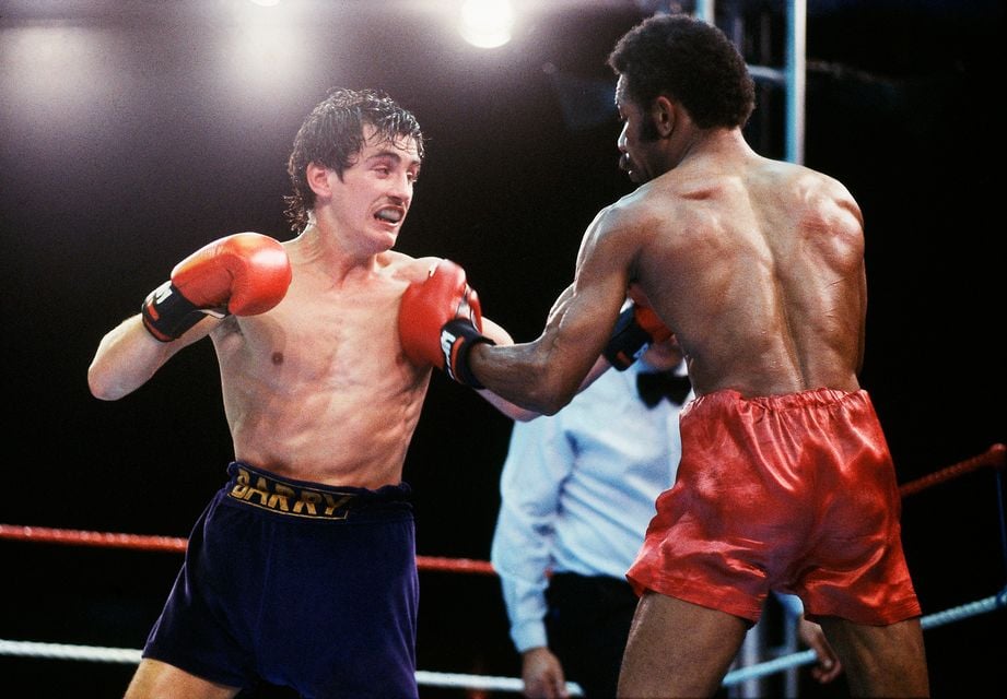 Barry McGuigan in action against WBA champion Eusebio Pedroza during their world title bout at Loftus Road