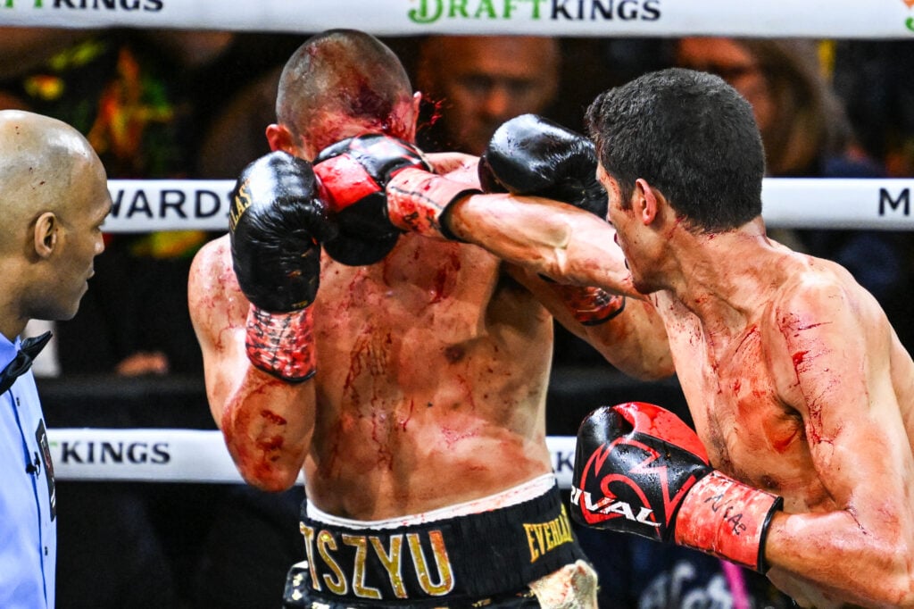 Tim Tszyu takes a left straight to the face from Sebastian Fundora, both men are covered in blood