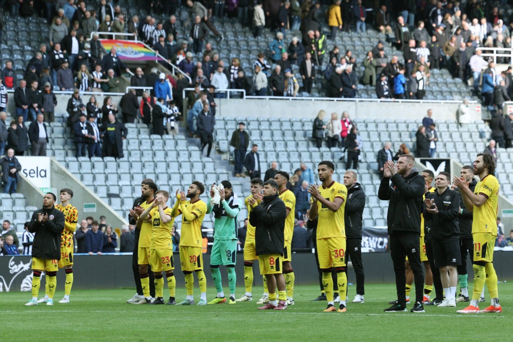 Players and staff of Sheffield United applaud the fans after the team's defeat, which confirms Sheffield United's relegation from the Premier League, in the Premier League match between Newcastle United and Sheffield United