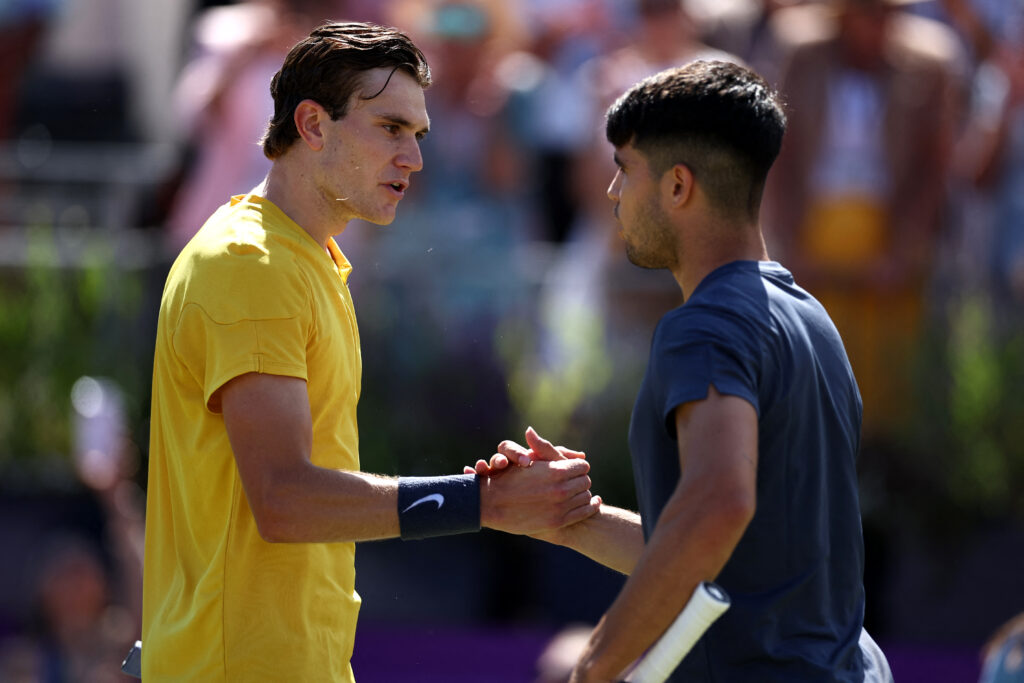 Carlos Alcaraz and Jack Draper shake hands at the net after their match at Queen's in 2024