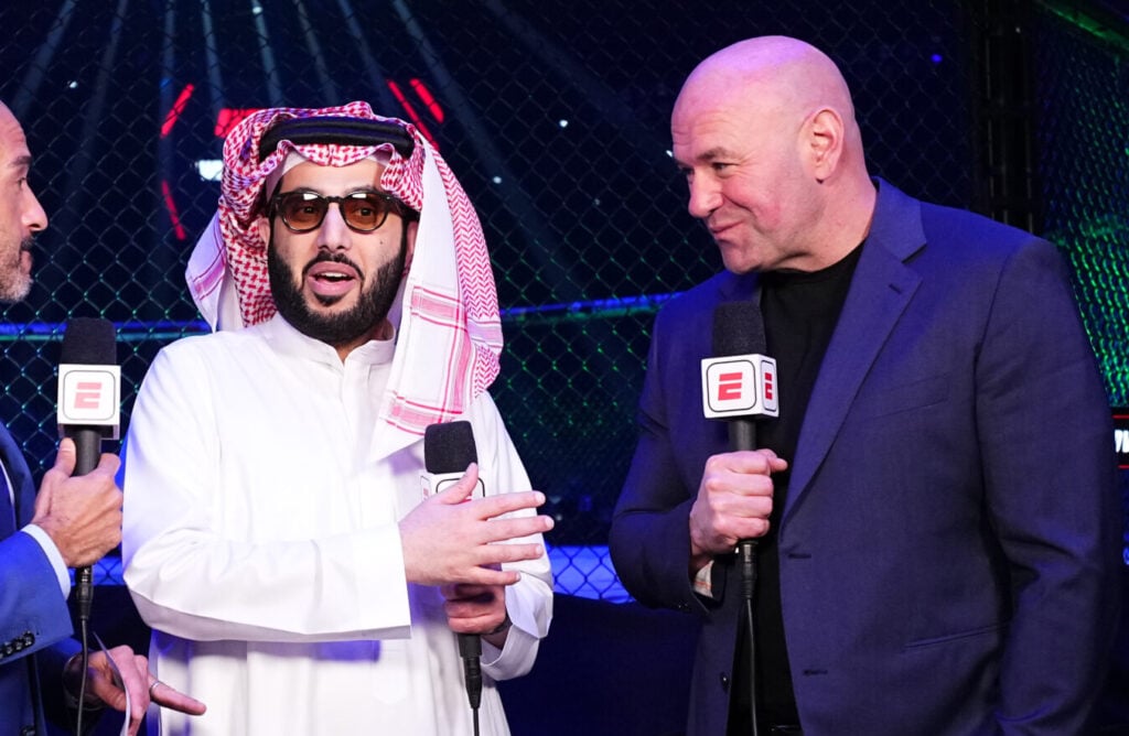 Turki Alalshikh and Dana White speak into ESPN microphones