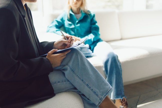 Two women sitting in armchairs and talking. Female coach, psychotherapist, psychologist, advisor and patient, client, psychotherapy, job interview