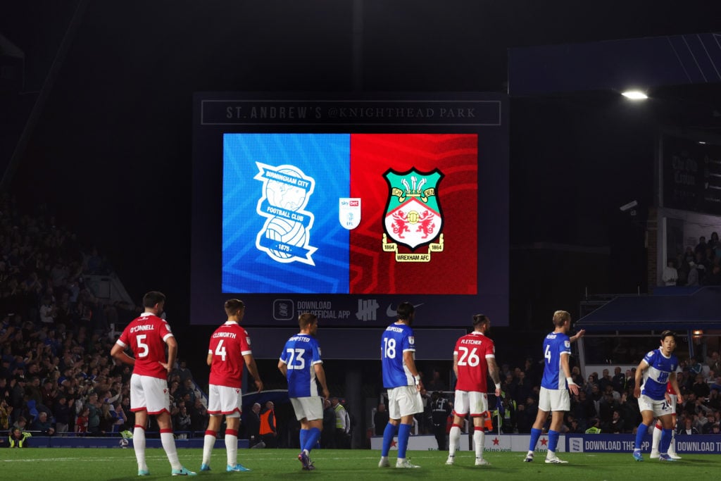 View of the club badges displayed on the screen during the Sky Bet League One match between Birmingham City FC and Wrexham AFC