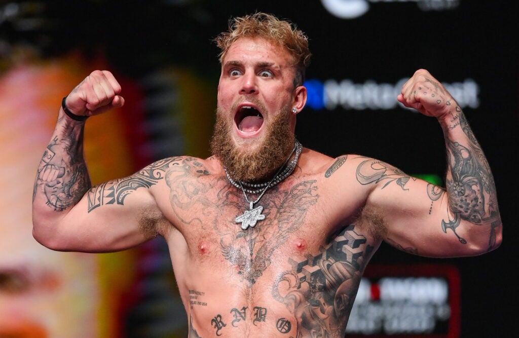 Jake Paul poses on the scale during the ceremonial weigh-in for Paul vs. Tyson