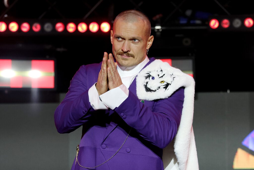 Oleksandr Usyk acknowledges the fans during the grand arrivals for his rematch with Tyson Fury