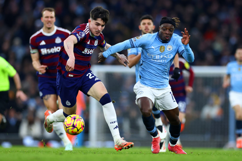 Tino Livramento challenging Jeremy Doku for the ball during Manchester City vs Newcastle United in the Premier League.