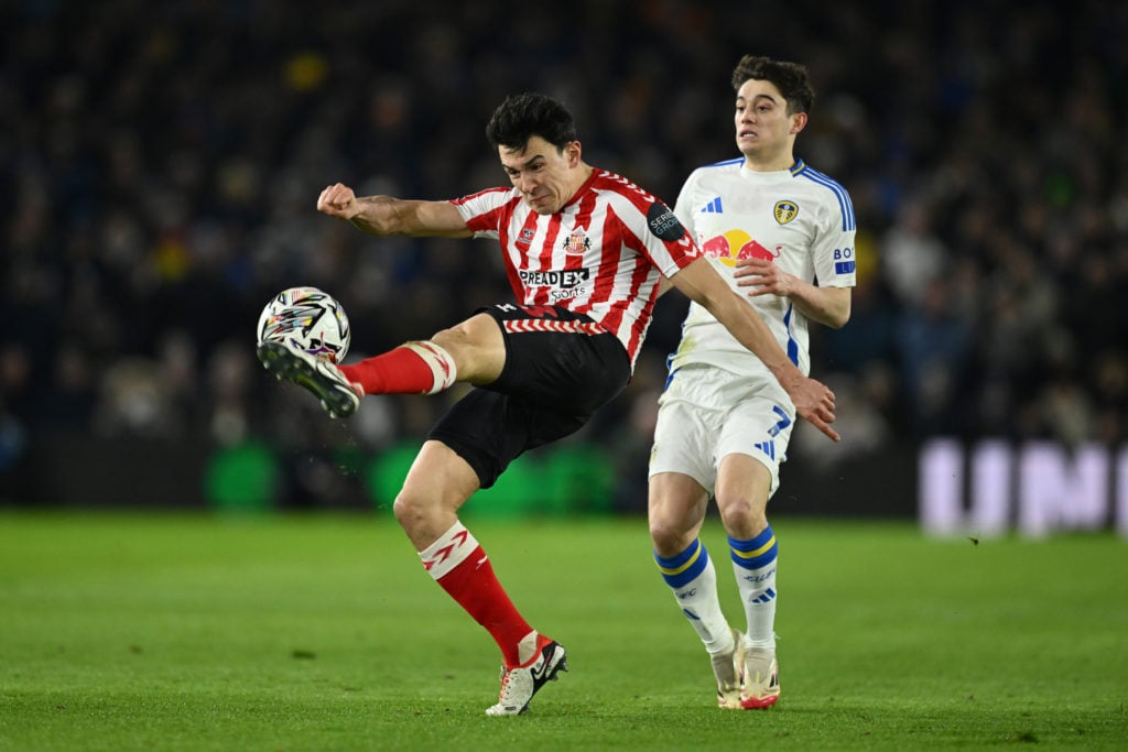 Luke O'Nien of Sunderland clears under pressure from Daniel James of Leeds United during the Sky Bet Championship match between Leeds United FC and Sunderland AFC at Elland Road