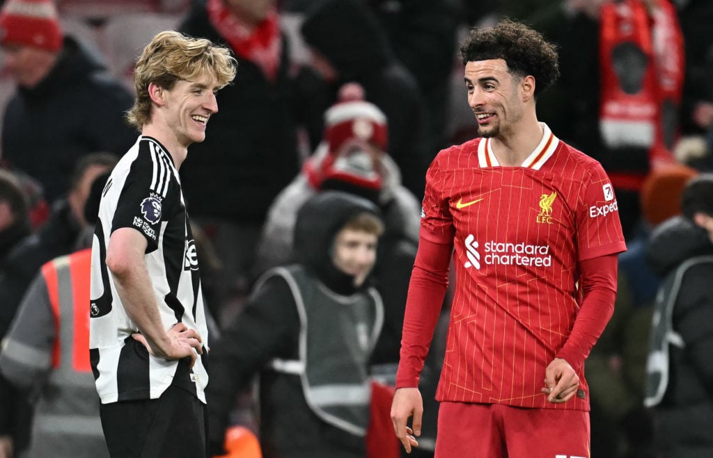 Newcastle United's English midfielder Anthony Gordon and Liverpool midfielder Curtis Jones react at the final whistle during the English Premier League football match between Liverpool and Newcastle United at Anfield