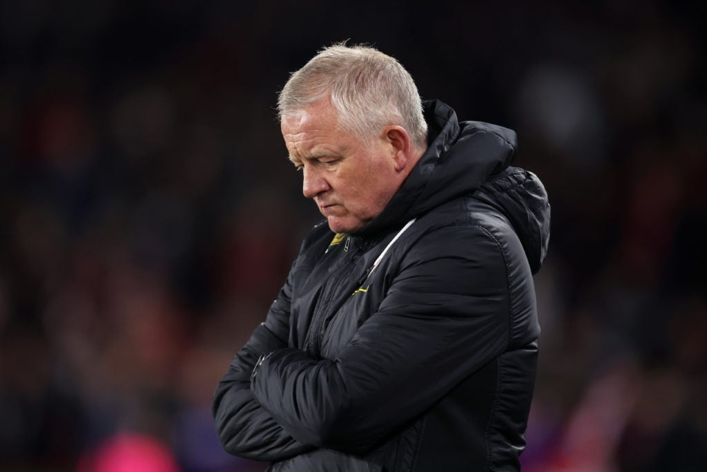 Sheffield United manager Chris Wilder looking down during a match.