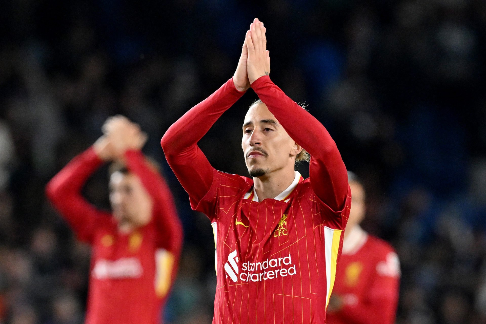 Liverpool defender Kostas Tsimikas acknowledges Liverpool fans.