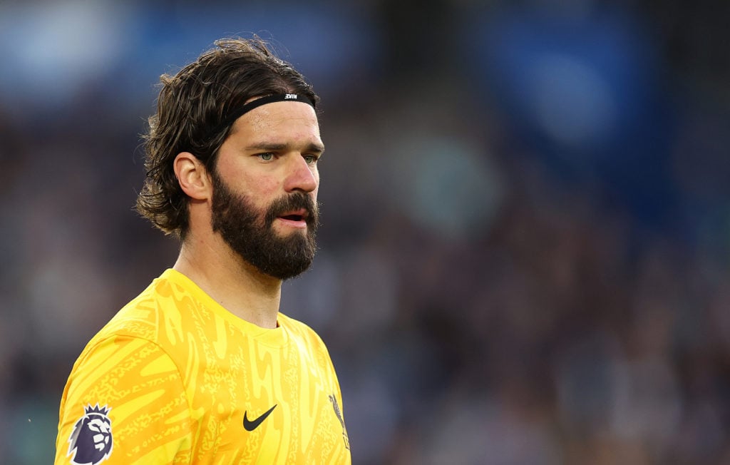 Alisson pictured in action for Liverpool during their game against Brighton.