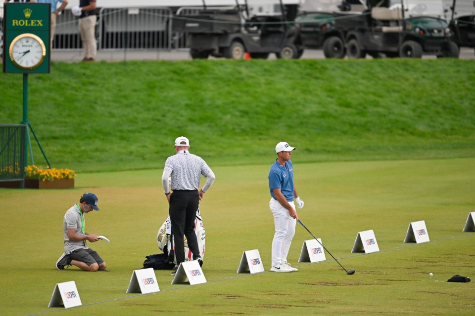 Hovland was joined by his caddie and coaches during a late night practice