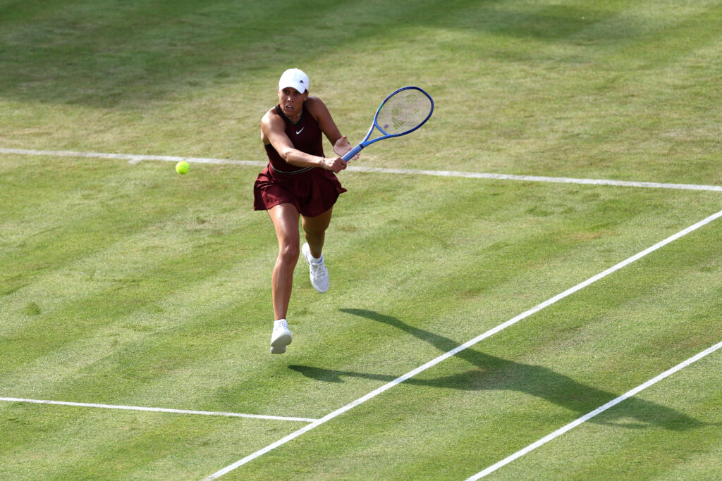 Madison Keys plays a backhand in her opening win at Queen's in 2025.