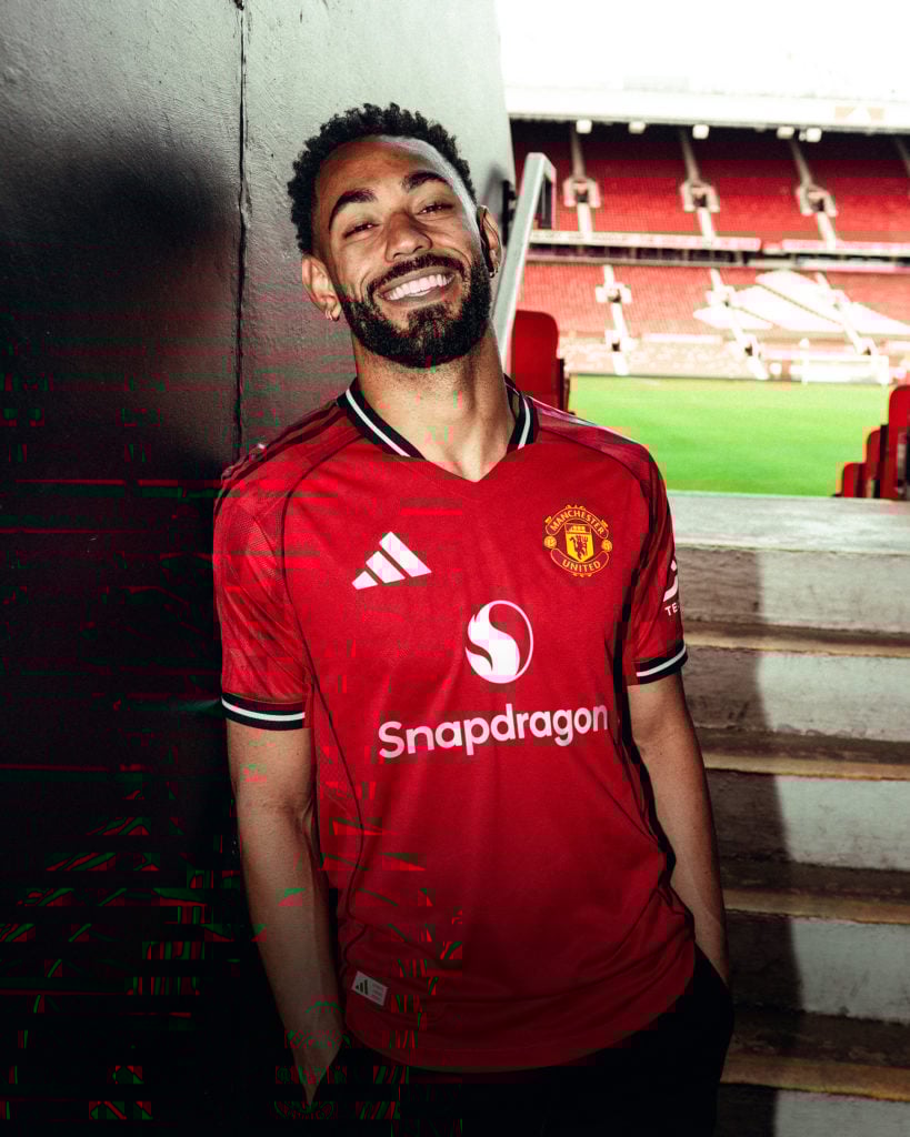 Matheus Cunha of Manchester United poses for a photo after signing his contract with the club