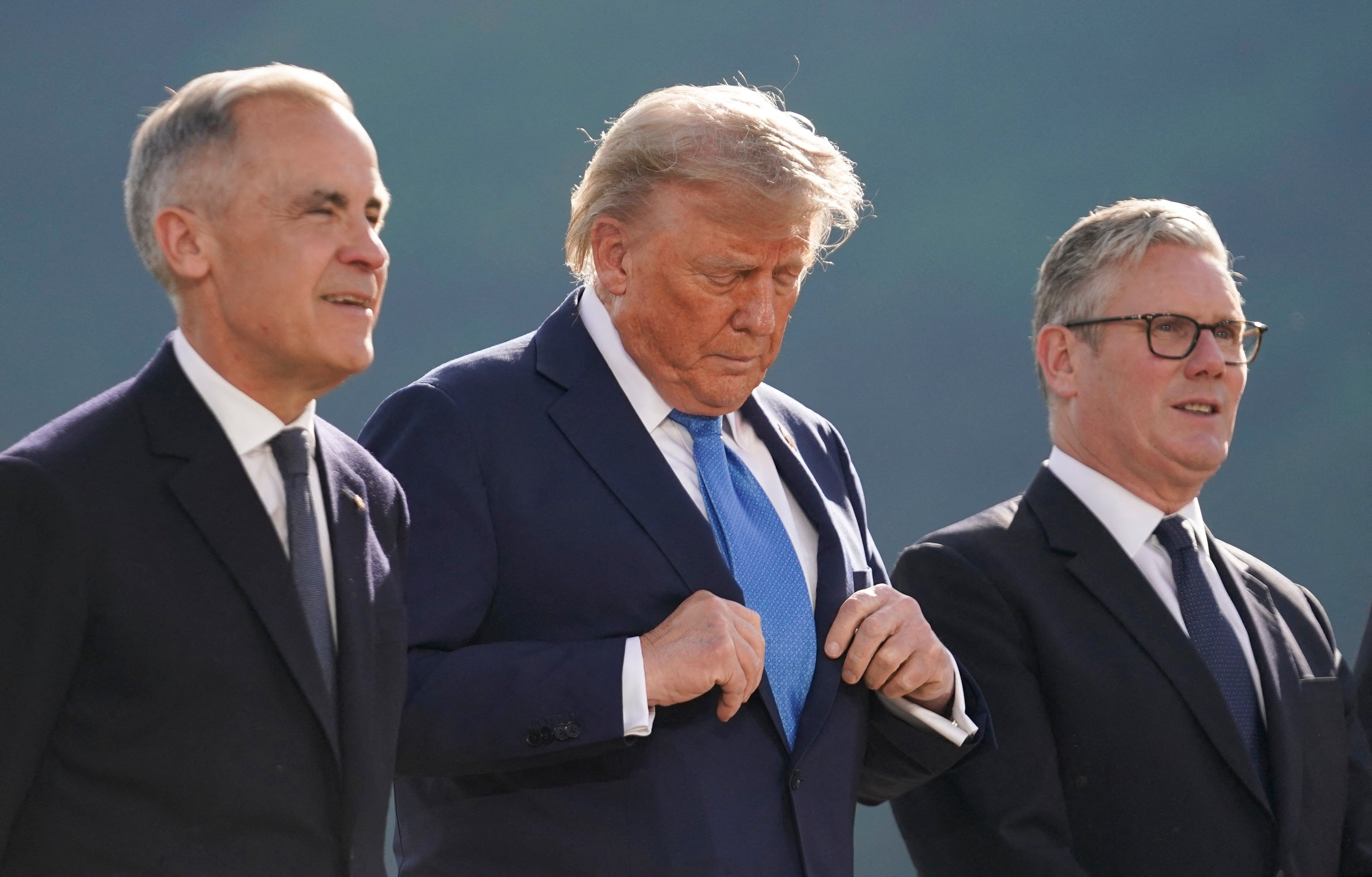 Canadian prime minister Mark Carney, US president Donald Trump and British prime minister Keir Starmer pose for a family photo during the Group of Seven (G7) Summit at the Kananaskis Country Golf Course in Kananaskis, Alberta, Canada