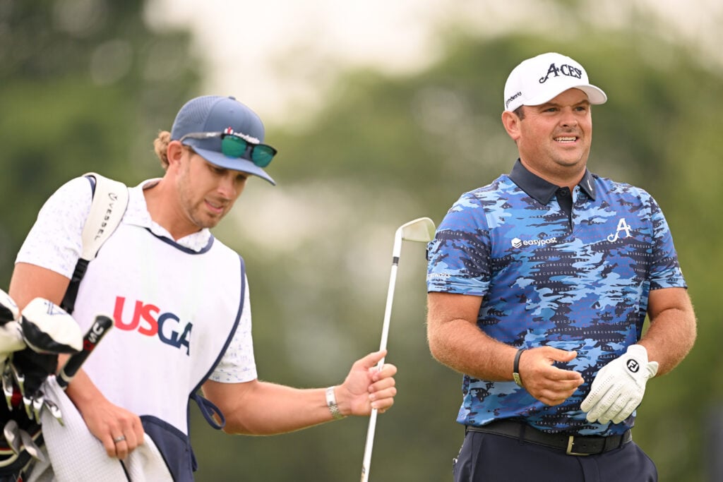 Patrick Reed speaks to his caddie during the second round of the US Open