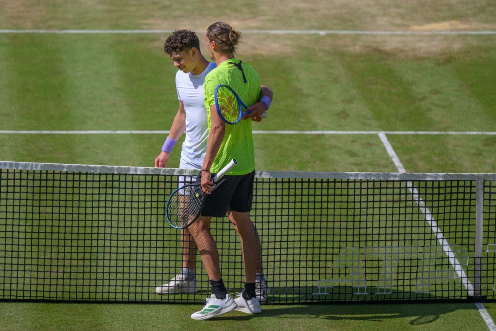 Alexander Zverev and Ben Shelton hug at the net in Stuttgart.