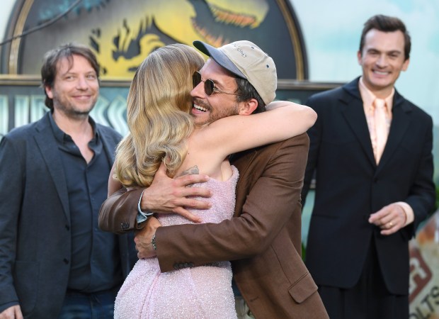 LONDON, ENGLAND - JUNE 17: Scarlett Johansson hugs Jonathan Bailey as they attend the "Jurassic World Rebirth" World Premiere at the Odeon Luxe Leicester Square on June 17, 2025 in London, England. (Photo by Joe Maher/Getty Images)