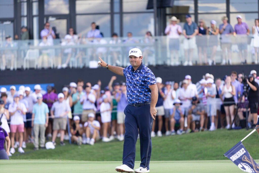 Patrick Reed celebrates holing the putt to win LIV Golf Dallas