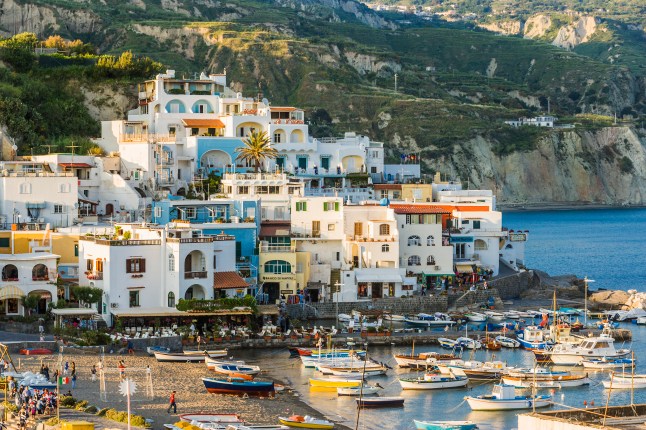 Buildings stacked along the harbour of Italy's Ischia Island.