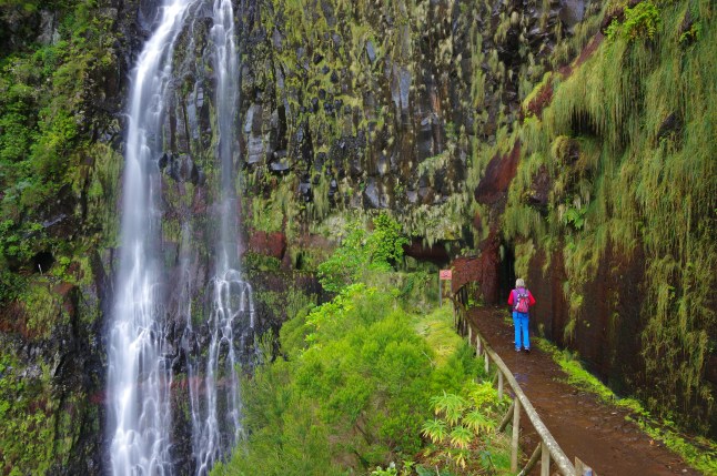 Levada pathway-Woman in Risco waterfall -Madeira island- Portugal