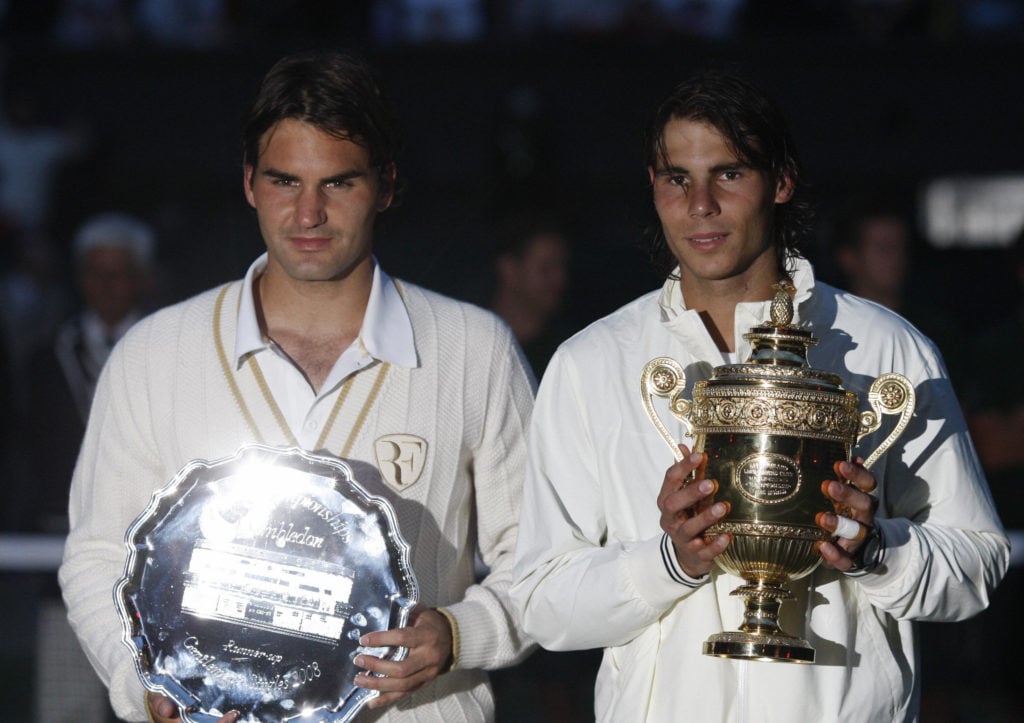 Roger Federer and Rafael Nadal holding their trophies after the Wimbledon final in 2008.