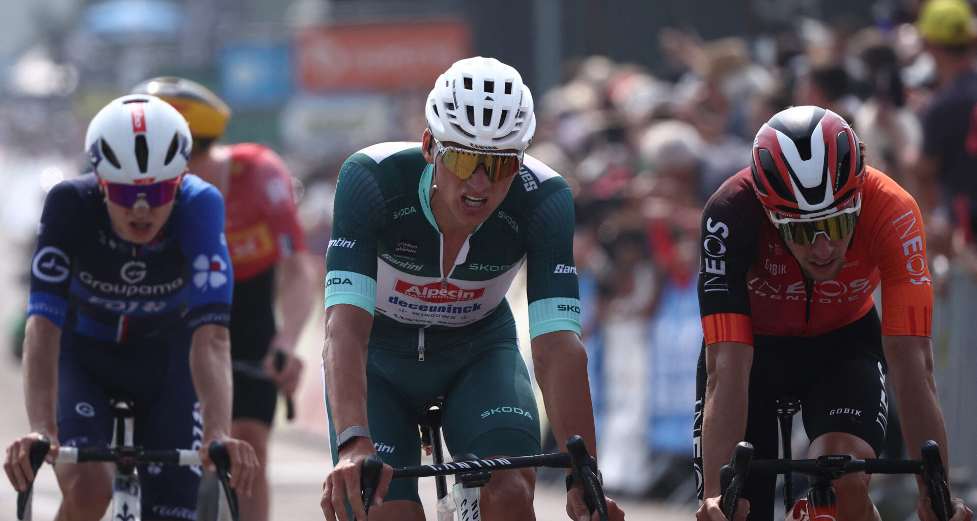 Alpecin-Deceuninck's Dutch rider Mathieu van der Poel (C) wearing the sprinter's green jersey reacts as he crosses the finish line of the 3rd stage of the 77th edition of the Criterium du Dauphine cycling race, 207,2 km between Brioude and Charantonnay, on June 10, 2025. (Photo by Anne-Christine POUJOULAT / AFP) (Photo by ANNE-CHRISTINE POUJOULAT/AFP via Getty Images)