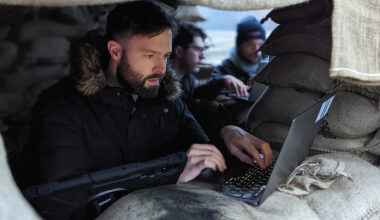 Man at laptop in a defense bunker