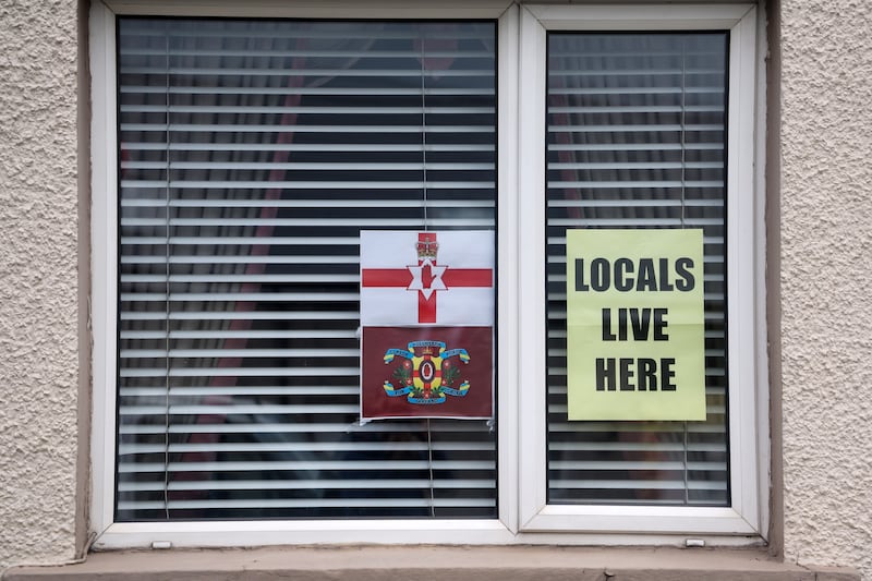 Flags and bunting and other british emblems in the windows of homes in Ballymena following anti-migrant intimidation earlier this month. PICTURE: MAL MCCANN