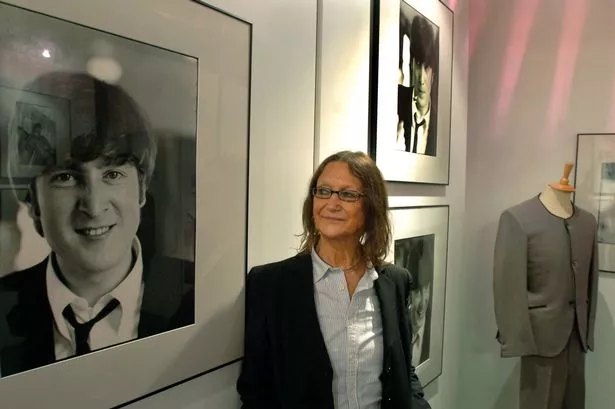 Julia Baird with an image of her brother John Lennon