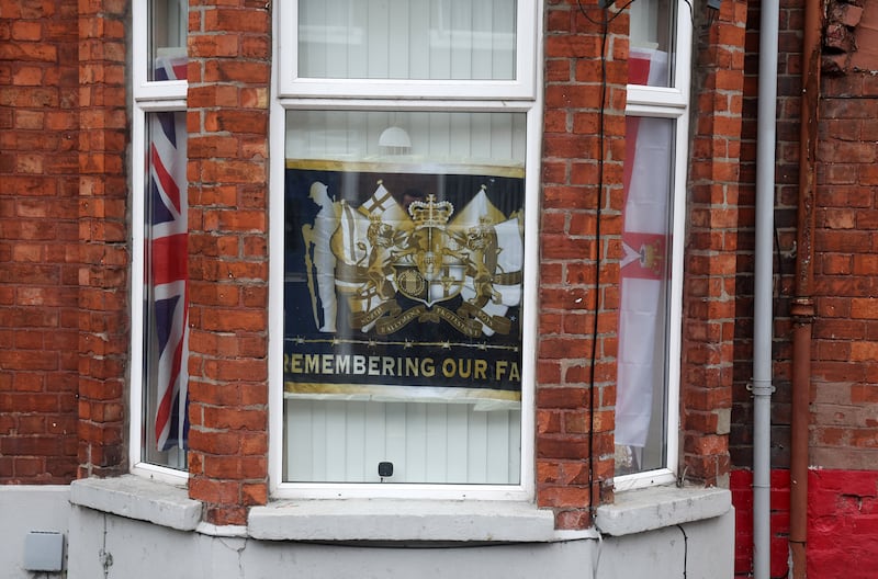 Flags and bunting and other british emblems in the windows of homes in Ballymena following anti-migrant intimidation earlier this month. PICTURE: MAL MCCANN