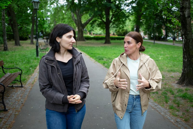 Coleen Rooney UNICEF High Profile Supporter talks with Yuliia Karpenko in a park near Cracow main train station. Cracow