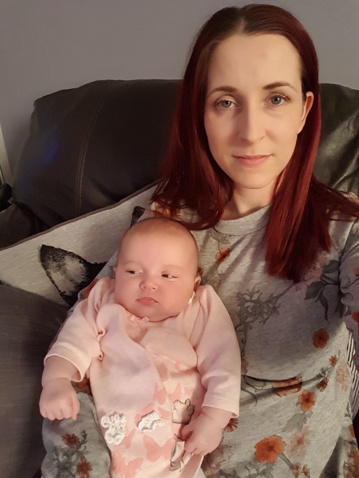 A woman holding a baby.