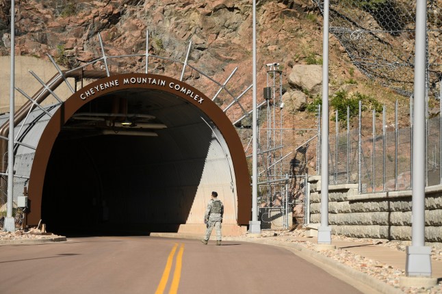 COLORADO SPRINGS, CO - MAY 10: A soldier walks into the mouth of the tunnel at Cheyenne Mountain Air Force Station on May 10, 2018 in Colorado Springs, Colorado. NORAD is celebrating its 60th Anniversary. (Photo by RJ Sangosti/The Denver Post via Getty Images)