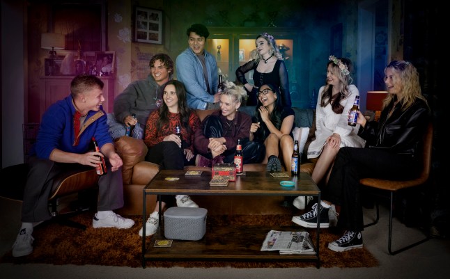 Coronation Street publicity photo of Dylan, Brody, Amy, Nina, Lauren, Asha, Aadi, Betsy and Summer laughing at a party