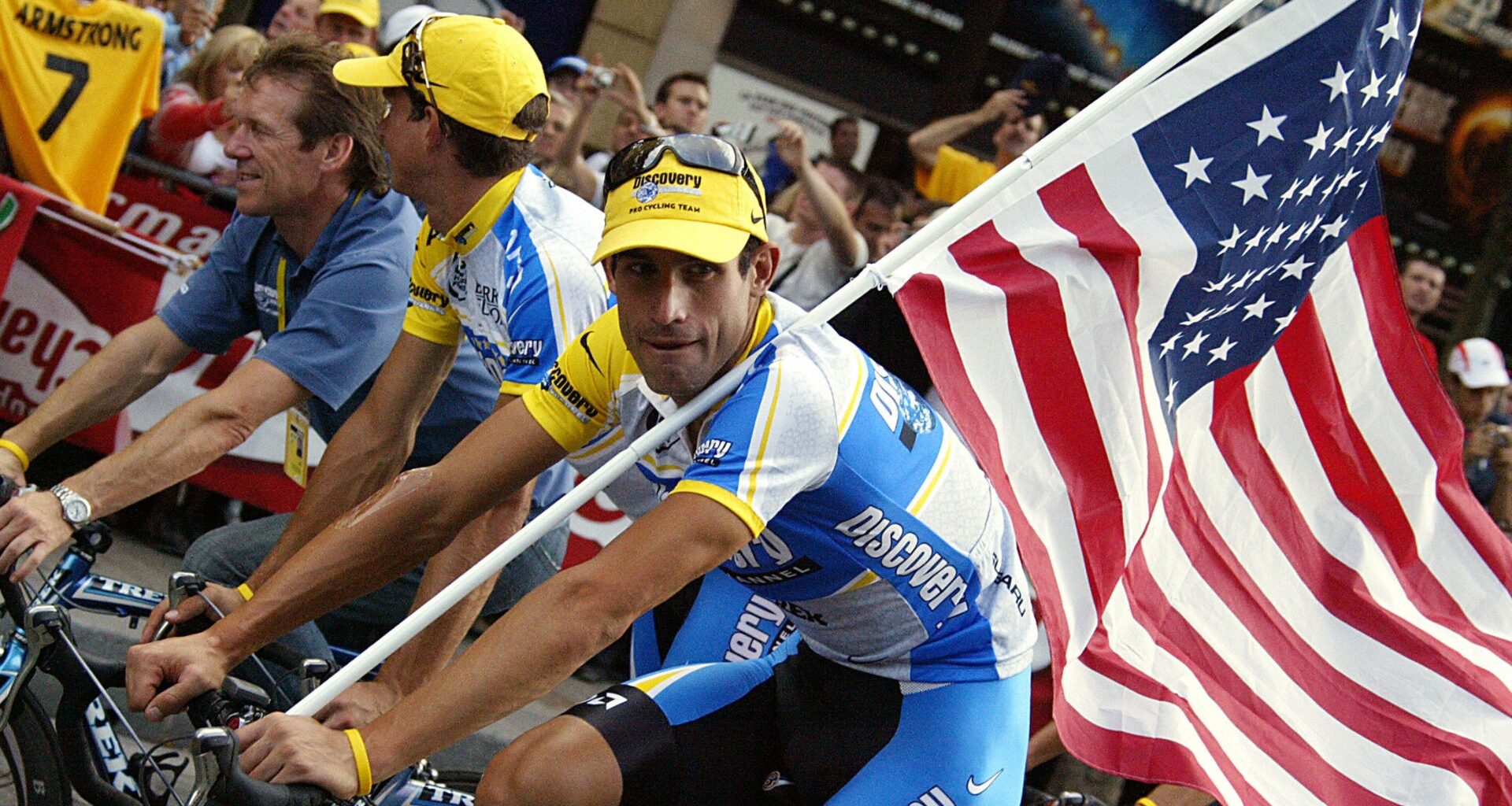 George Hincapie carrying an American flag