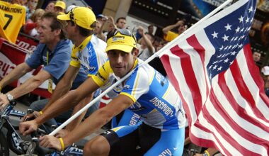 George Hincapie carrying an American flag