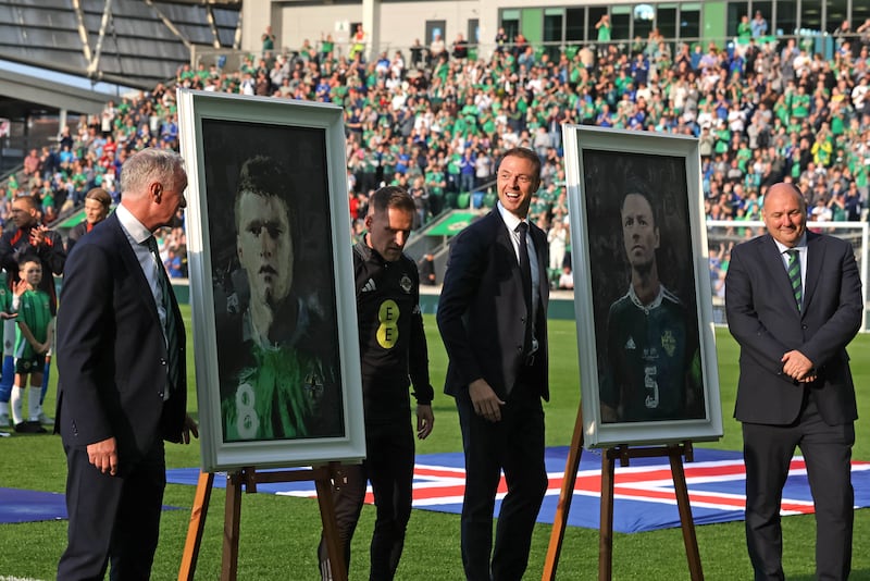 (left to right) Northern Ireland's manager Michael O'Neill, former Northern Ireland international Steven Davis, former Northern Ireland international footballer Jonny Evans, President of the Irish Football Association Conrad Kirkwood at a portrait unveiling before the international friendly match at the Clearer Twist National Stadium at Windsor Park, Belfast. Picture date: Tuesday June 10, 2025.