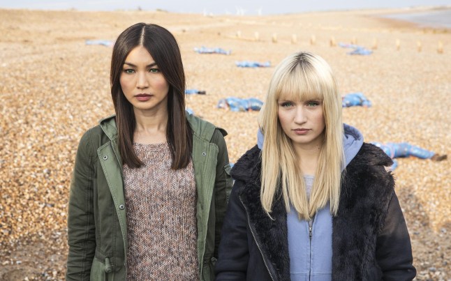 Gemma Chan as Mia and Emily Berrington as Niska in Humans In modern clothing on a beach