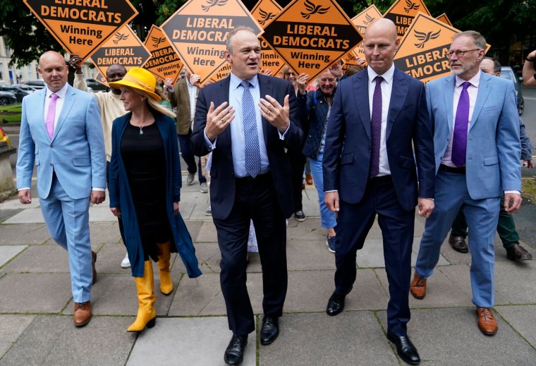 Liberal Democrat leader Sir Ed Davey walks with Liberal Democrat prospective parliamentary candidates Cameron Thomas(left), Roz Savage (second left), Max Wilkinson and Paul Hodgkinson (right) during a visit to the town centre in Cheltenham, Gloucestershire, while on the General Election campaign trail. Picture date: Thursday May 23, 2024. PA Photo. See PA story POLITICS Election LibDems. Photo credit should read: Andrew Matthews/PA Wire