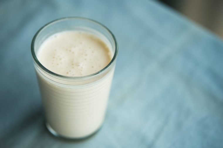 Glass of fermented Kefir or Ayran on the table.