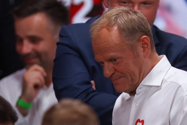 Civic Coalition's Polish Prime Minister Donald Tusk reacts after the exit poll announcement of the second round of presidential election in Warsaw, Poland, June 1, 2025. REUTERS/Kacper Pempel