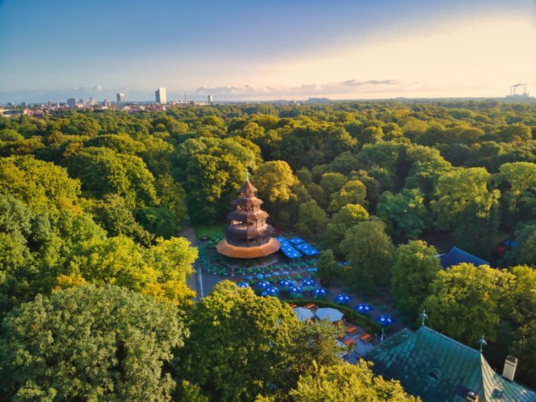 Munich, Germany ??? August 17, 2021: Aerial view of chinese tower in english garden munich. Historic building is a popular beer garden in central park of bavarian capital