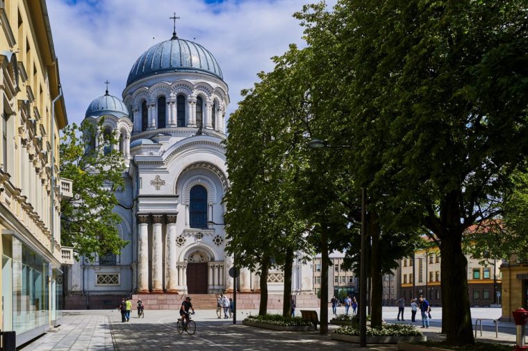 Lithuania, Kaunas, Laisves avenue, the popular walking street in the Art Deco district of the city, terminates in front of Saint Michael Archangel church