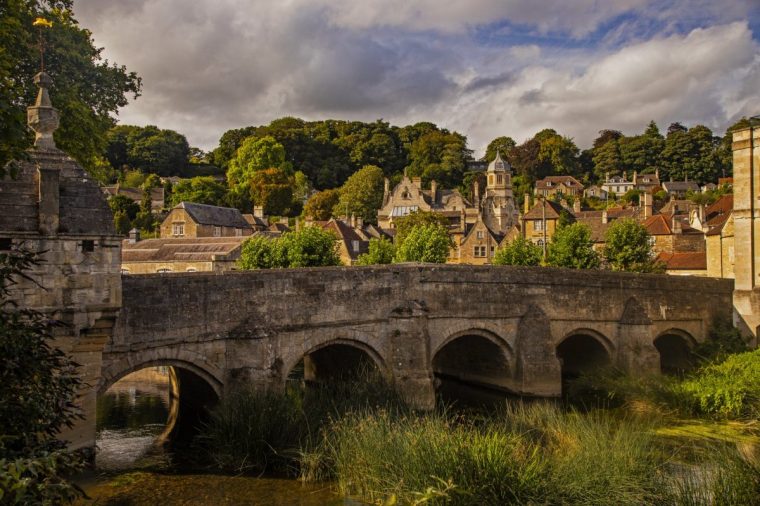 Bradford-on-Avon is a town in Wiltshire, United Kingdom. It is well known for its canal, historic buildings, shops, pubs and restaurants The Town Bridge over the river Avon has a domed building that was the lockup, where the town's troublemakers were put for short periods.
