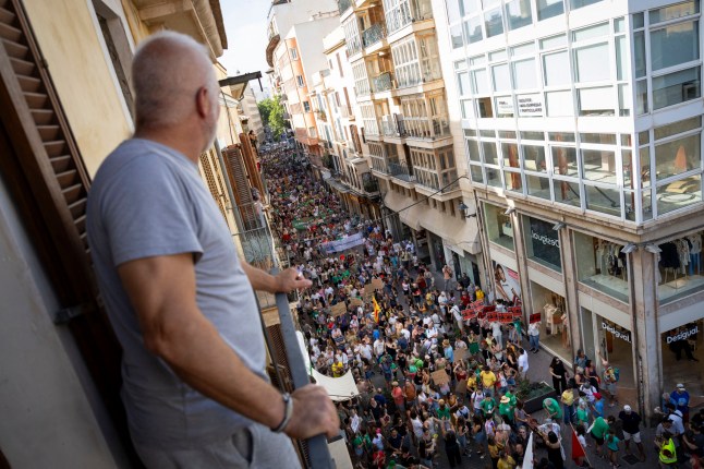 Demonstrators take part in a protest against mass tourism and housing prices in Palma de Mallorca, on the Balearic island of Mallorca on June 15, 2025. (Photo by JAIME REINA / AFP) (Photo by JAIME REINA/AFP via Getty Images)
