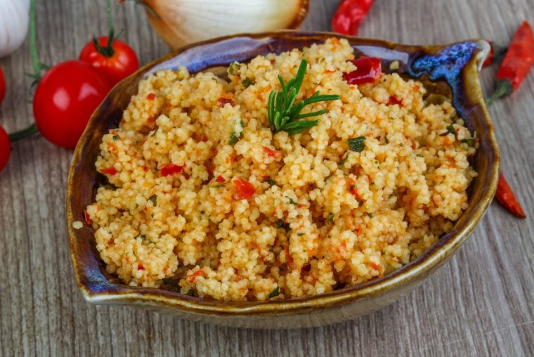Arabic traditional cuisine - Couscous with tomato and green onion